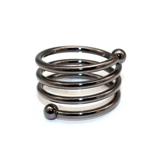 Close-up detail of the gunblack metal spiral napkin ring featuring dual bead ends.