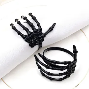Black skeleton hand napkin rings for Halloween table decor, gothic table setting holders