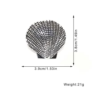 Detailed dimension view of vintage metal shell napkin ring, elegant table decor item.