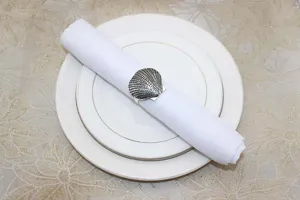 Vintage metal seashell napkin ring set for elegant table decor and wedding dinner party.