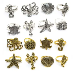 Vintage metal marine napkin rings, gold and silver starfish octopus table decor set.