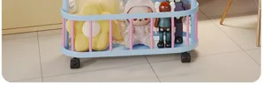 Mobile storage cart detail shot showing blue rolling rack with trendy plush toys and figures.