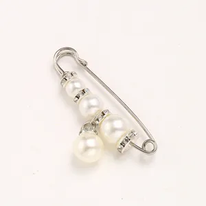 Pearl rhinestone safety pin brooch for waist adjustment, anti-glare clothing accessory.