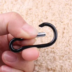 Black aluminum alloy carabiner snap hook spring clip for outdoor camping and luggage hanging.