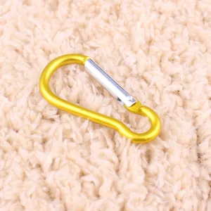 Gold aluminum alloy gourd carabiner detail, spring snap hook for outdoor camping and bags.