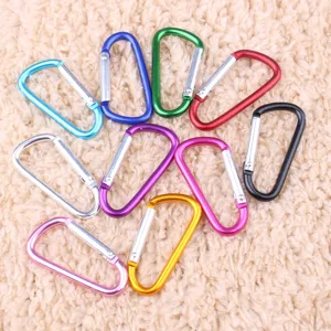 Colorful aluminum alloy D-shaped carabiners, compact clip details for outdoor backpacks.