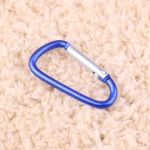 Blue aluminum alloy D-ring carabiner close-up detail shot, durable outdoor camping gear clip.