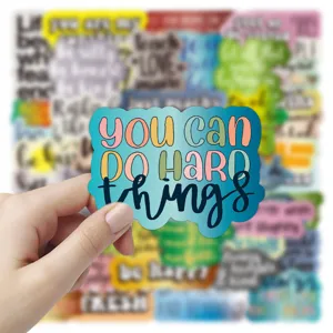 Waterproof inspirational quote sticker detail, perfect for personalizing notebooks and luggage.