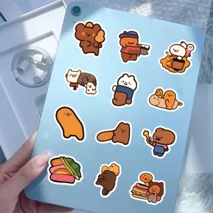Detailed view of cute cartoon bear and animal stickers displayed on a blue tablet device.