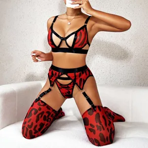 Conjunto de lencería sexy de malla transparente roja y negra con sujetador y medias.