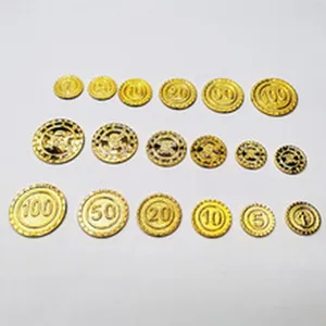 Gold game tokens and coins set with numbers and cute character designs for party toys.