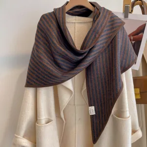 Close-up detail of the cozy vertical striped triangle shawl scarf, soft texture.