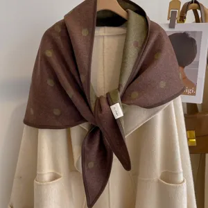 Detailed view of the vintage polka dot jacquard reversible triangle shawl fabric.