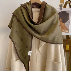 Close-up view of the cozy thickened star jacquard triangular scarf showing fine bound edges.