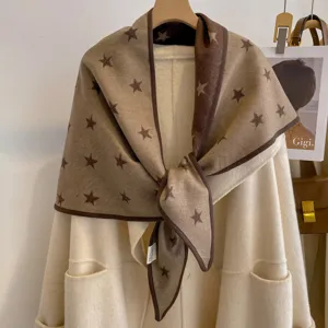 Detailed view of the warm star jacquard triangular shawl featuring exquisite bound edge.