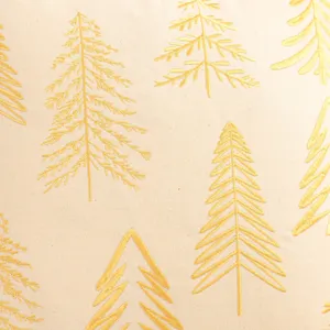 Gold embroidered Christmas tree pattern detail on beige canvas pillowcase fabric close-up
