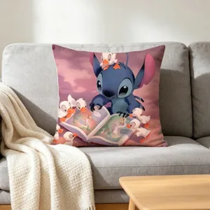 Close-up detail of a cute cartoon character print throw pillow on a cosy grey sofa.