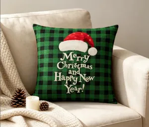 Detailed view of the Christmas buffalo plaid throw pillow with Santa hat and festive text.