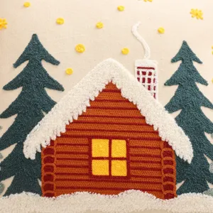 Christmas embroidered canvas cushion cover with snow cabin and pine tree pattern design.