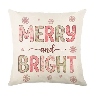 Fodera per cuscino natalizio rosa con design di testo floreale MERRY e BRIGHT per divano.