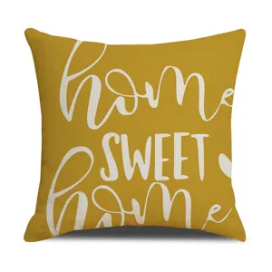 Yellow linen throw pillow cover with white home sweet home text print for sofa decor.