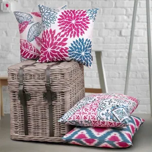 Close-up detail of abstract floral and geometric print throw pillow covers, home decor.