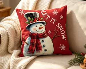 Red Christmas pillow cover featuring a cute snowman design and festive snow flakes print for home.