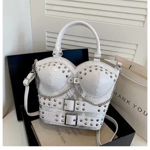 Trendy white Y2K corset handbag with metal studs, buckles, and chain strap for women daily.