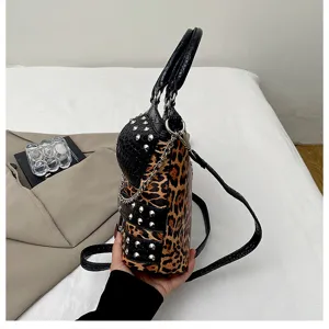 Y2K leopard print and snake texture handbag with metal studs and chain strap, stylish design.