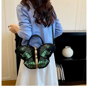 Unique butterfly shaped crossbody bag, stylish black and green shoulder handbag for women.