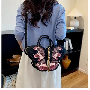 Chic butterfly shaped shoulder bag, unique black and pink niche crossbody handbag for women.