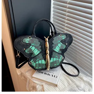 Unique butterfly shaped shoulder bag with striking green black wings and metallic gold body.