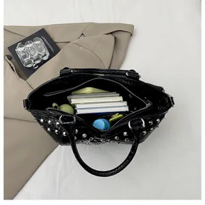 Black studded tote handbag with large capacity, stylish Y2K commute shoulder bag.