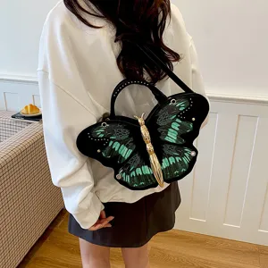 Chic butterfly shaped shoulder bag with green black wings and gold metal body crossbody purse