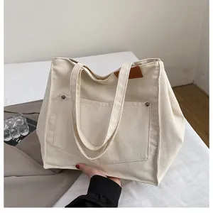 Casual canvas tote shoulder bag for women, large capacity retro fashion daily handbag.