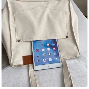 Simple casual canvas tote shoulder bag with front pocket and large capacity design.