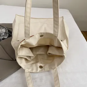 Minimalist canvas tote bag for women, large capacity shoulder bag, casual everyday handbag.
