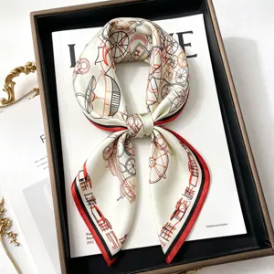 Detailed shot of a luxury printed silk square scarf with vintage carriage illustration.