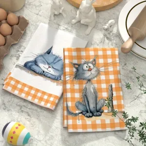 Vista dettagliata del panno da cucina in microfibra con gatto cartoon e motivo a quadri.