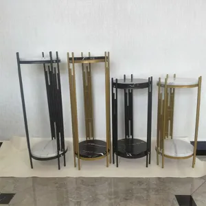 Modern Nordic luxury metal plant stands set with marble texture tops for living room decor.
