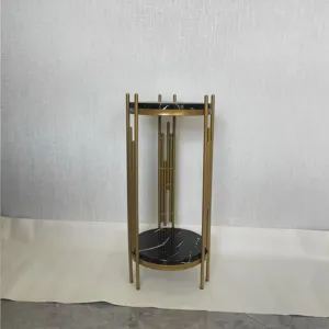 Nordic luxury plant stand detail, modern gold metal and black marble pattern round tier.