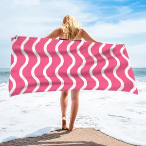 Pink and white wavy printed beach towel, quick-dry polyester fabric for summer vacation.