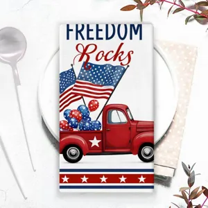 Gedetailleerd overzicht van de patriottische theedoek met rode vrachtwagen en Amerikaanse sterren.