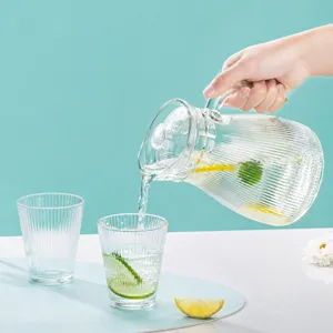Glass water pitcher set with ribbed design, modern transparent jug and cups for home daily use.