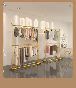 Detailed interior view of modern golden double layer clothes rack showcasing storage design.