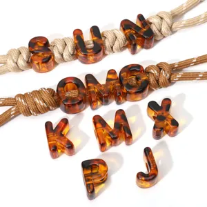 Acrylic tortoise shell leopard print large hole letter beads for DIY phone chains and charms.