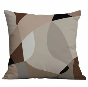 Close-up detail of modern abstract geometric pattern cushion cover in neutral earthy tones.