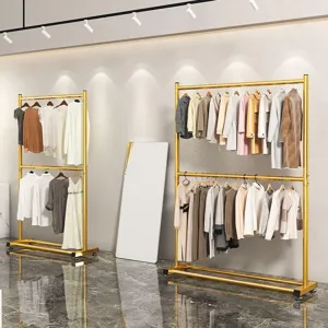 Double layer metal clothes rack freestanding garment pole for home balcony bedroom storage.