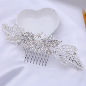 Detailed close-up of rhinestone butterfly pearl hair comb insert for elegant bridal updos.
