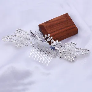 Silver metal hair comb detail, elegant leaf and flower design for chic updos and styling.